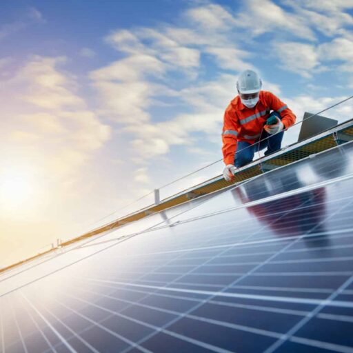 engineer working use a power check machine on checking power of solar panels on the roof, Solar energy technology concept